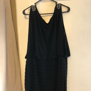 Black above the knee dress with jeweled shoulders.